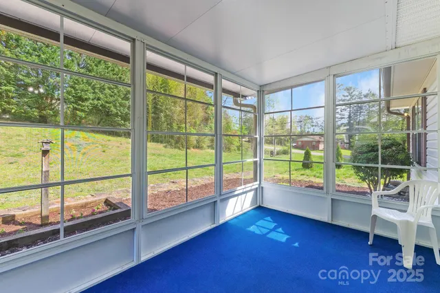 a view of an empty room with a large window