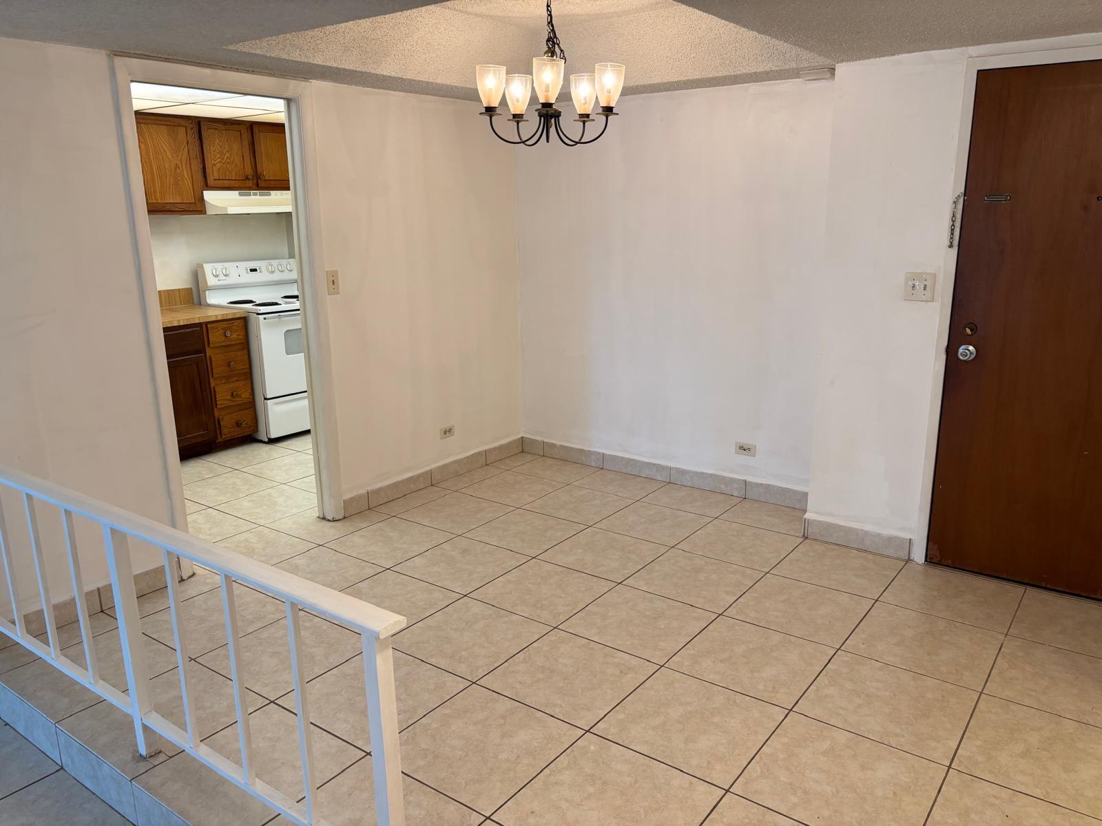 3650 Inverrary Drive, Unit 1K Lauderhill, FL 33319 - Photo 3 of 13 a view of a kitchen with a sink dishwasher and a refrigerator