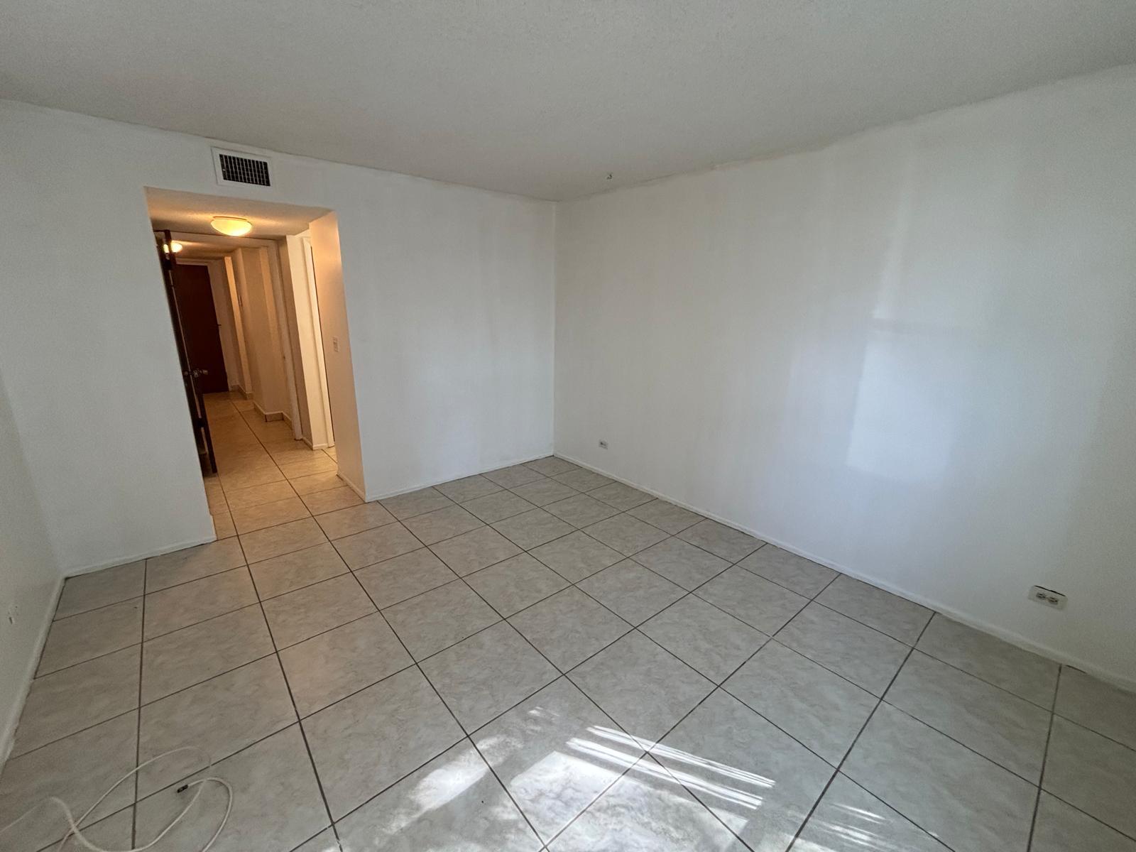 3650 Inverrary Drive, Unit 1K Lauderhill, FL 33319 - Photo 7 of 13 an empty room with windows