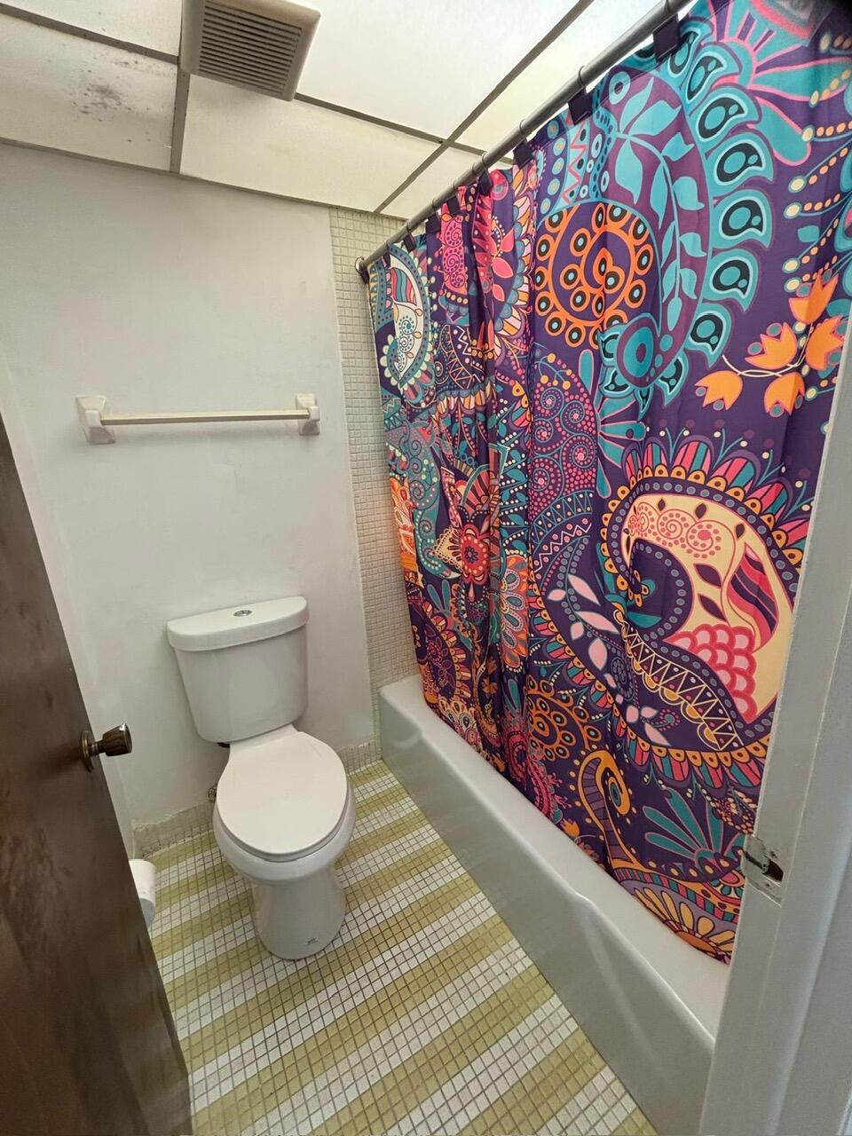 3650 Inverrary Drive, Unit 1K Lauderhill, FL 33319 - Photo 10 of 13 a bathroom with a toilet and a sink