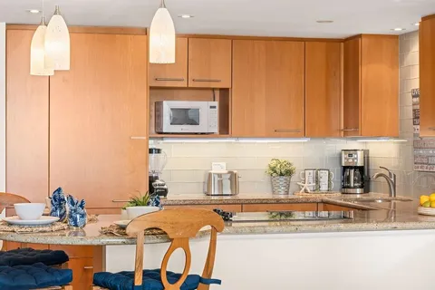 a kitchen with a sink and cabinets
