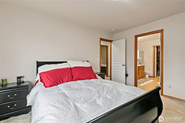 a bedroom with a bed and a dresser