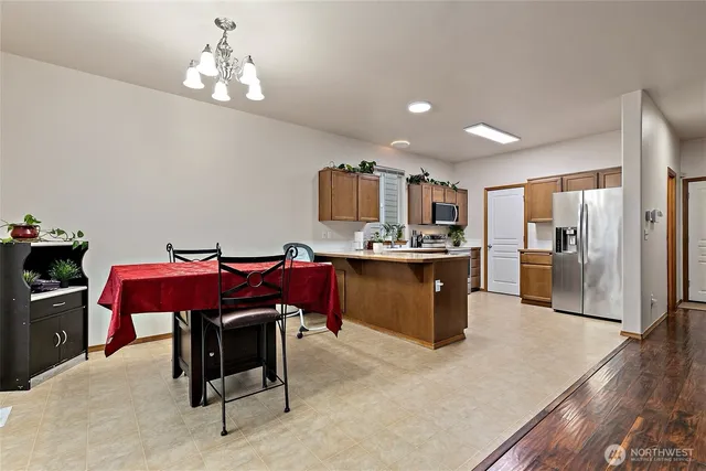 a kitchen with kitchen island a cabinets counter space and appliances