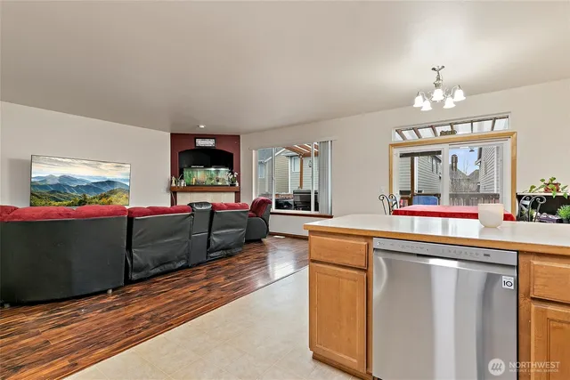 a kitchen with stainless steel appliances granite countertop a sink and cabinets