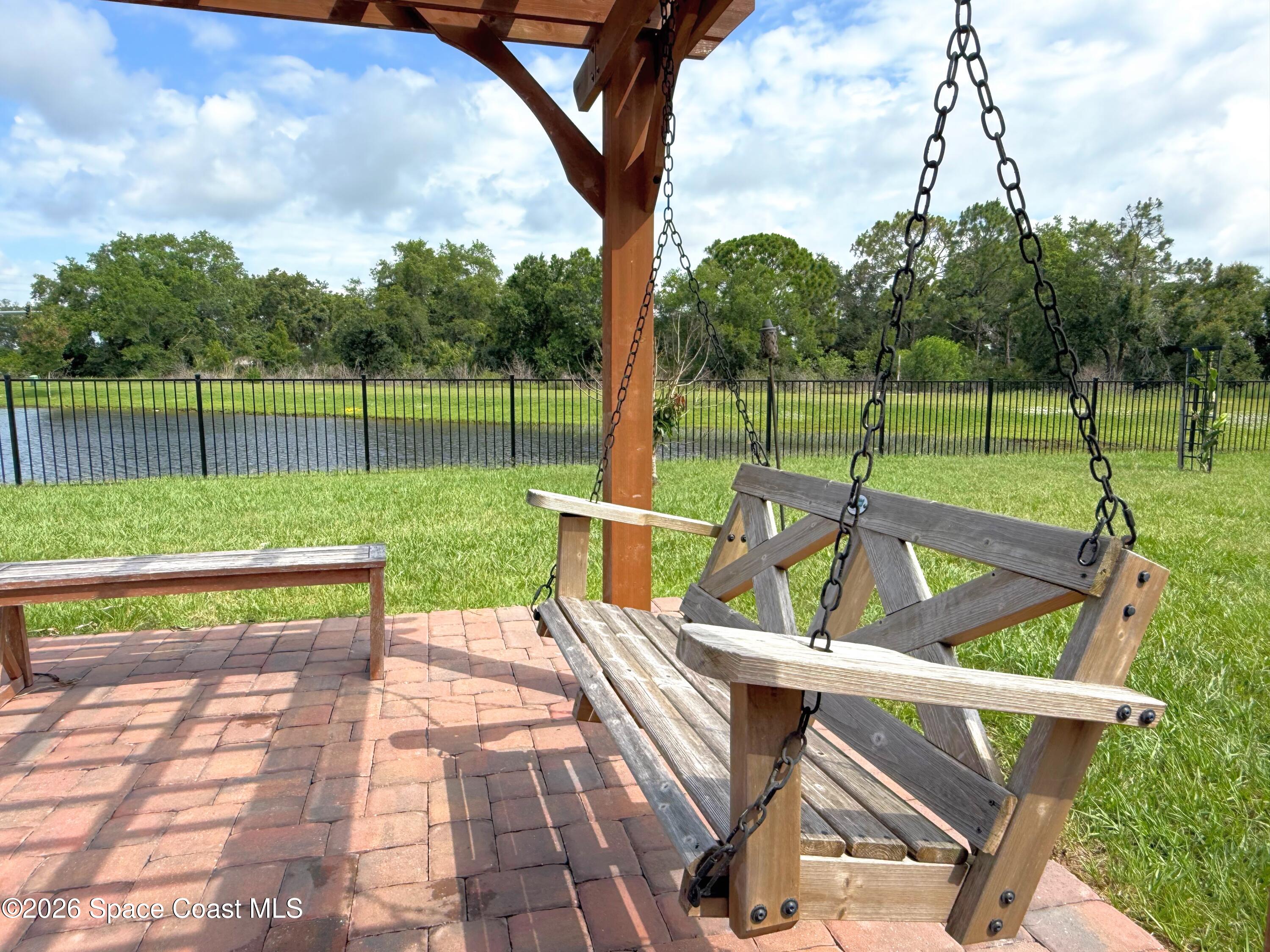 1873 Farmhouse Road Southeast Palm Bay, FL 32909 - Photo 23 of 35 pergola and patio swing