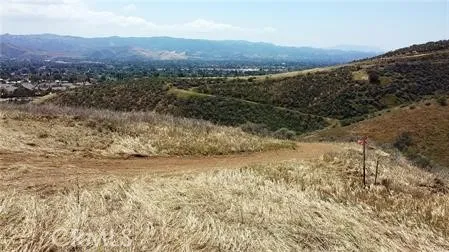 a view of a yard with an ocean