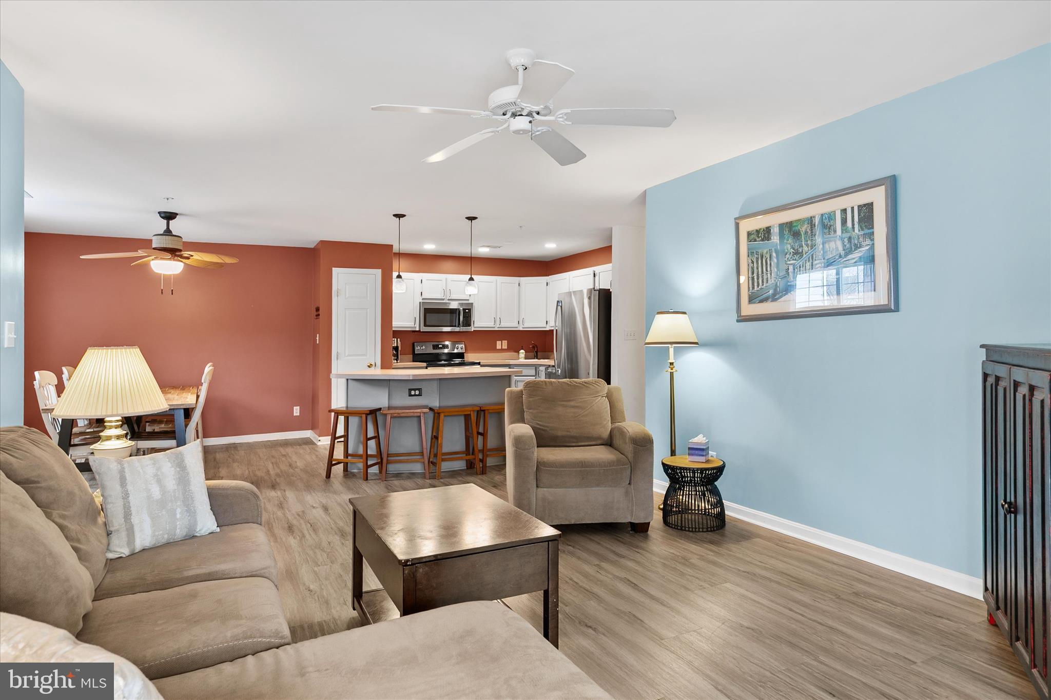 11423 Manklin Creek Road, Unit 1 Ocean Pines, MD 21811 - Photo 13 of 40 a living room with furniture and kitchen view