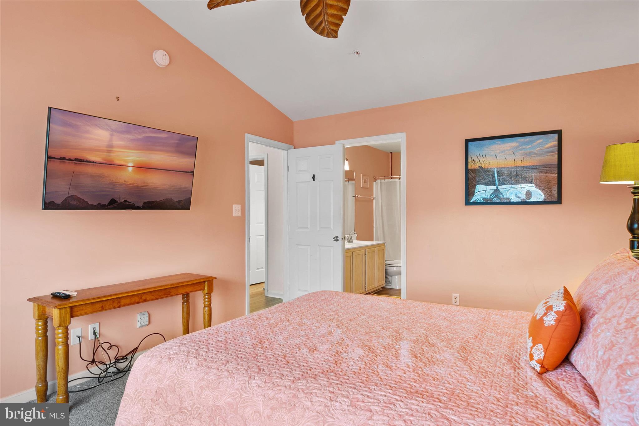 11423 Manklin Creek Road, Unit 1 Ocean Pines, MD 21811 - Photo 23 of 40 a bedroom with a bed and a flat screen tv
