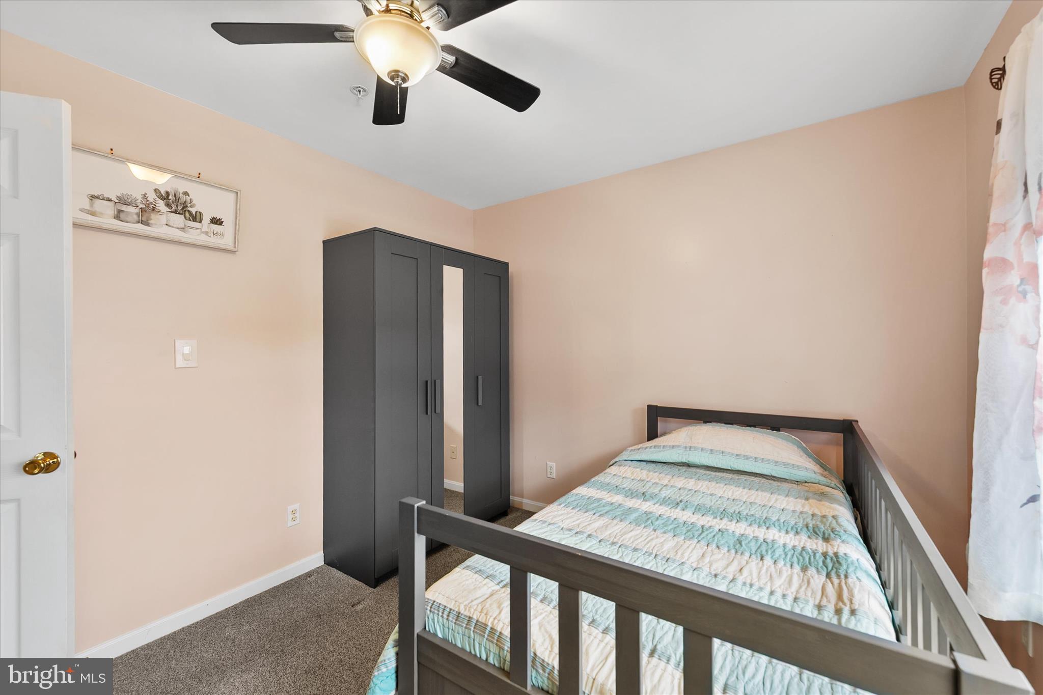 11423 Manklin Creek Road, Unit 1 Ocean Pines, MD 21811 - Photo 26 of 40 a bedroom with bed and wooden floor