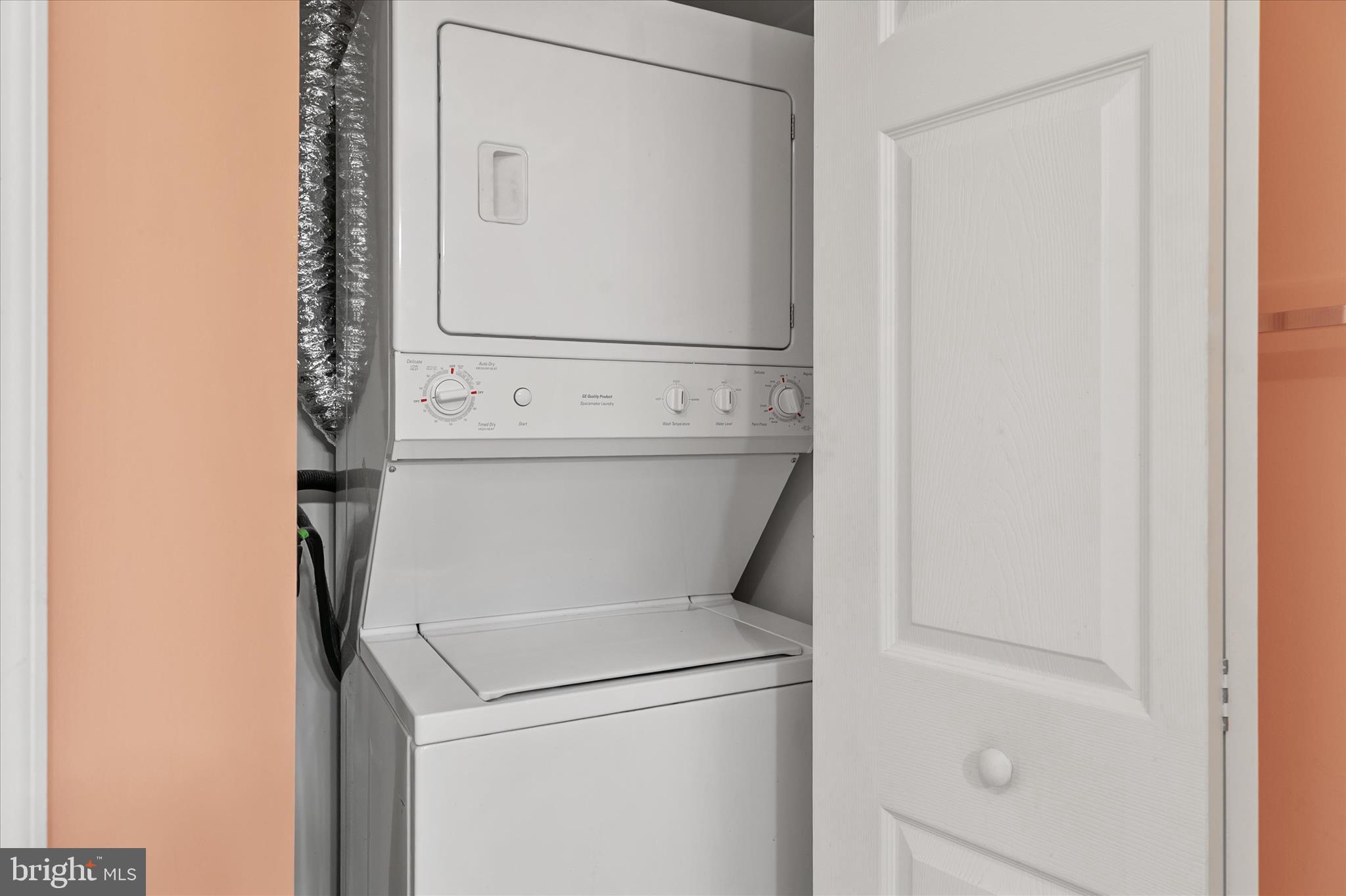 11423 Manklin Creek Road, Unit 1 Ocean Pines, MD 21811 - Photo 28 of 40 a close up view of a washer and dryer