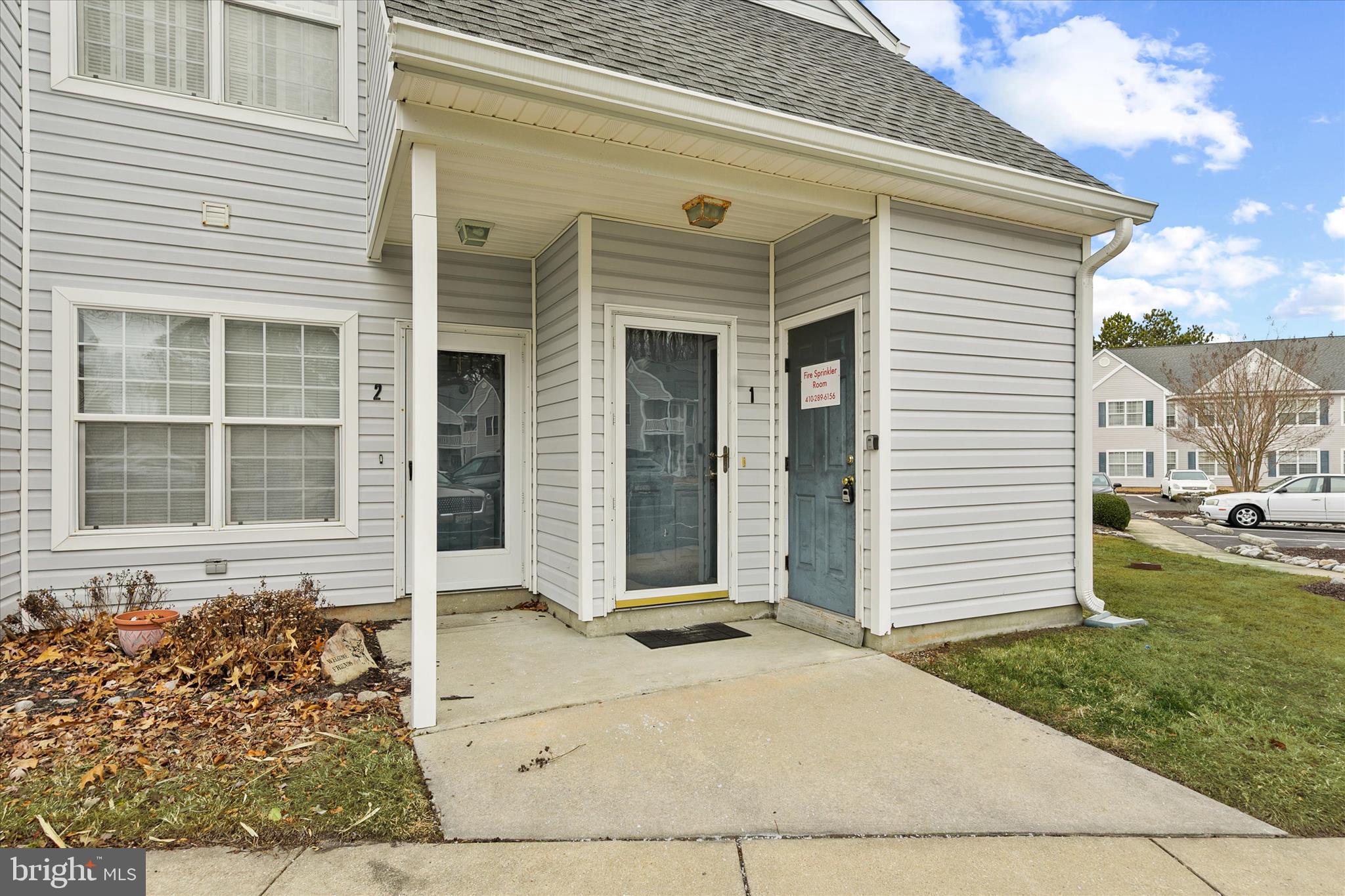 11423 Manklin Creek Road, Unit 1 Ocean Pines, MD 21811 - Photo 33 of 40 front view of a house with a yard