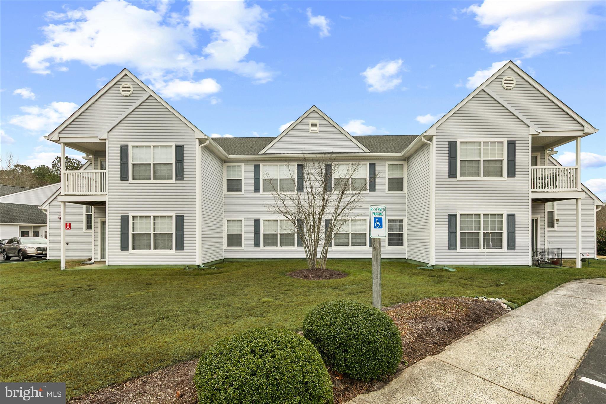 11423 Manklin Creek Road, Unit 1 Ocean Pines, MD 21811 - Photo 36 of 40 a front view of a house with a yard
