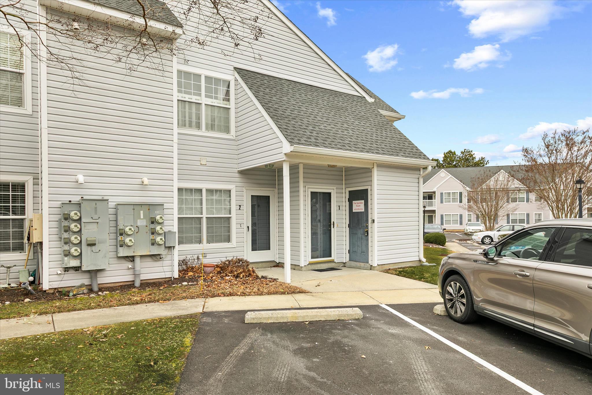 11423 Manklin Creek Road, Unit 1 Ocean Pines, MD 21811 - Photo 37 of 40 a view of a car park in front of a house