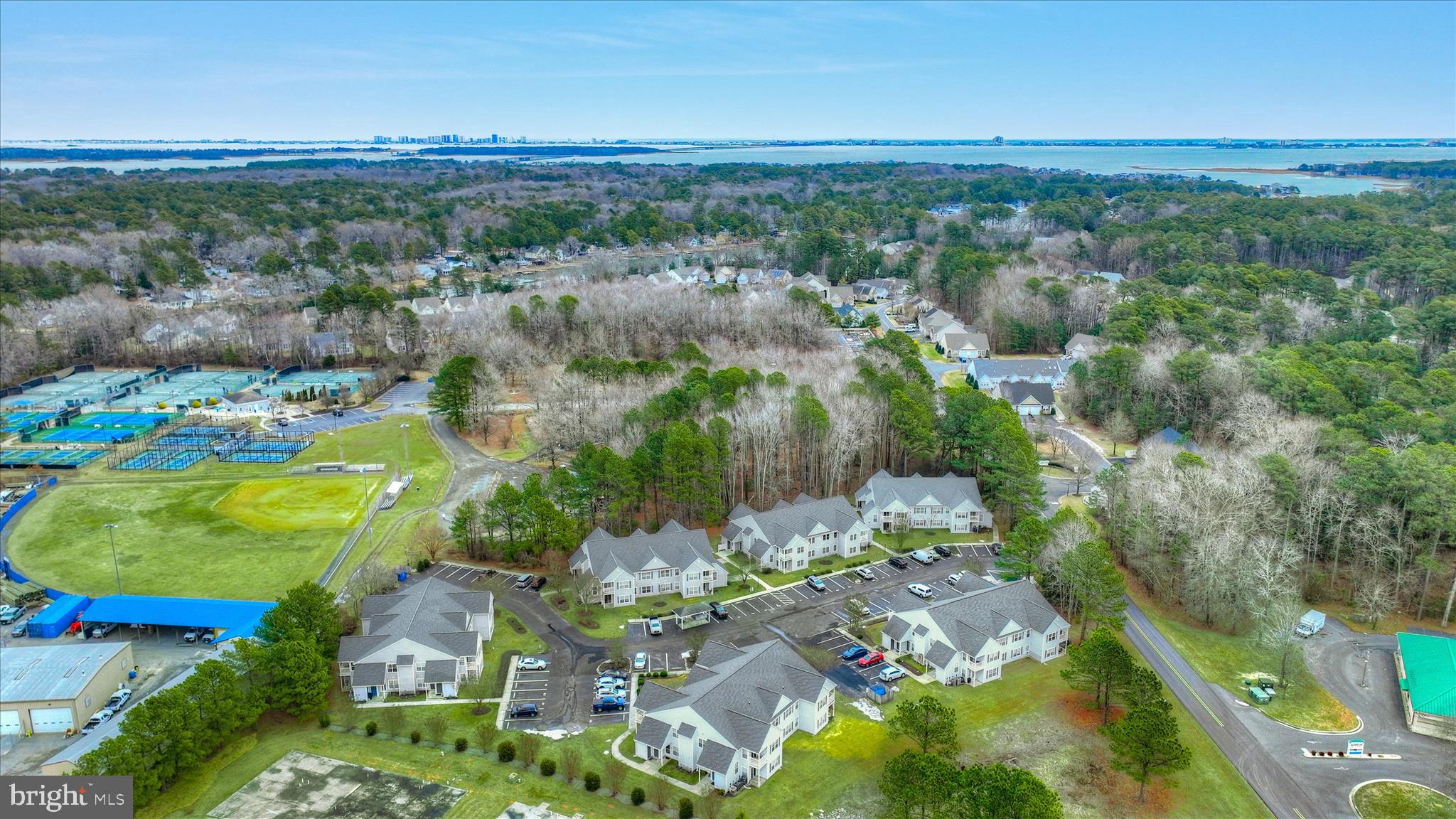 11423 Manklin Creek Road, Unit 1 Ocean Pines, MD 21811 - Photo 38 of 40 an aerial view of residential houses with outdoor space and trees