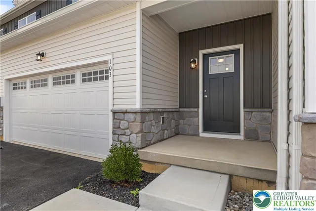a front view of a house with a garage
