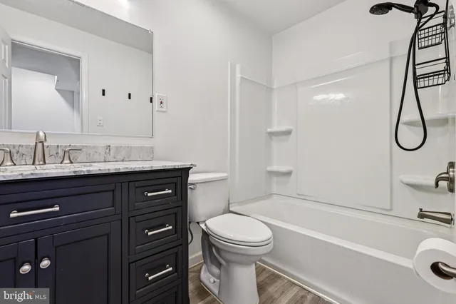 a bathroom with a sink a toilet and a bathtub