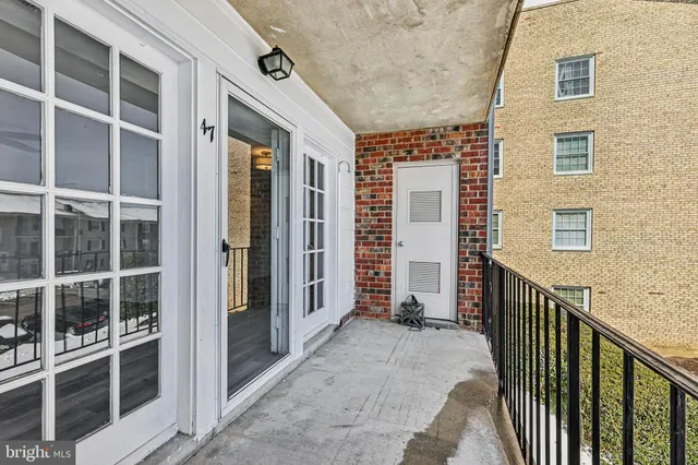 a view of balcony with stairs and wooden door