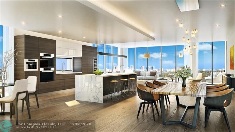 a large kitchen with a table and chairs