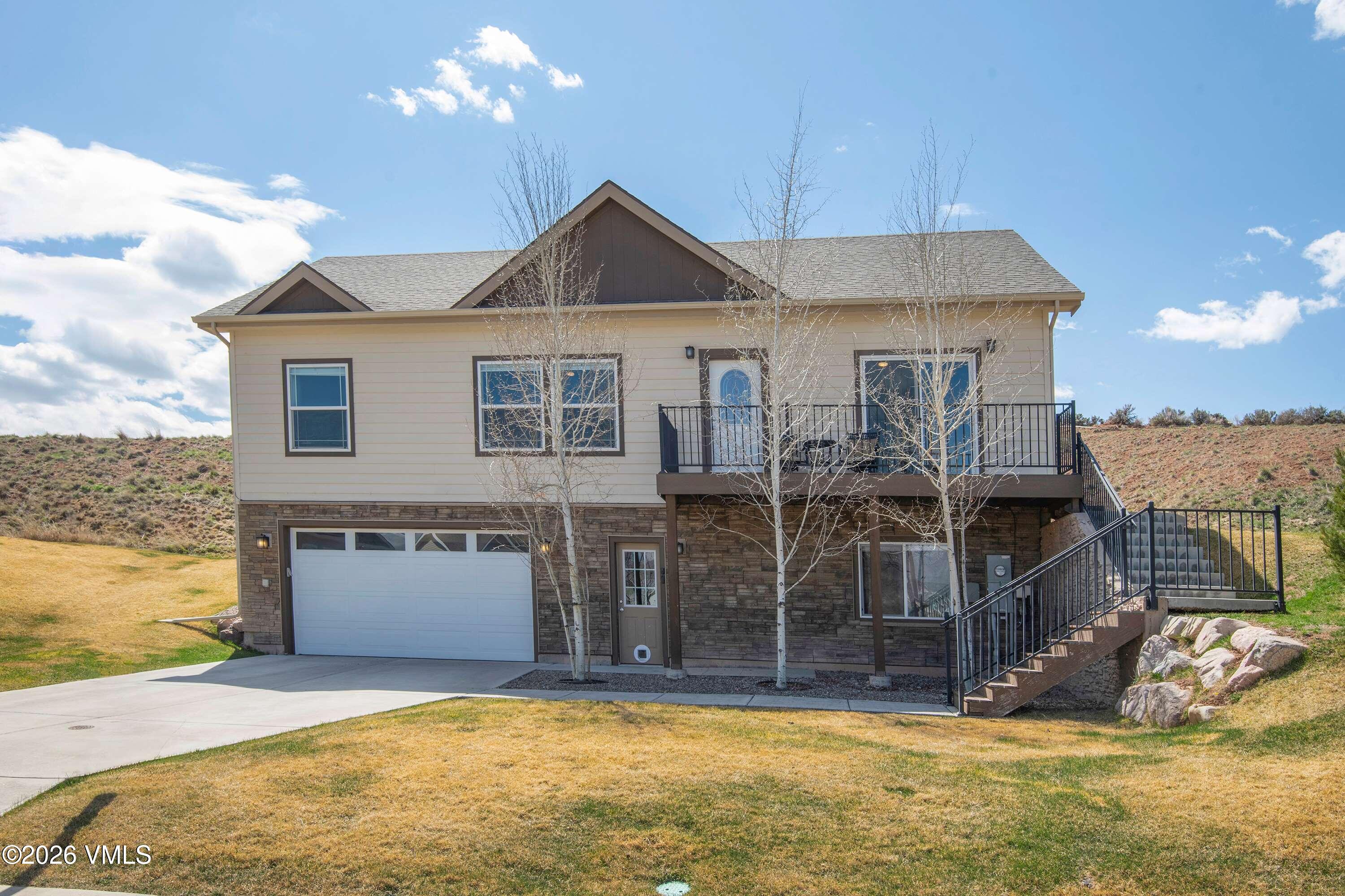 67 Maverick Court Gypsum, CO 81637 - Photo 1 of 40 a front view of a house with a yard