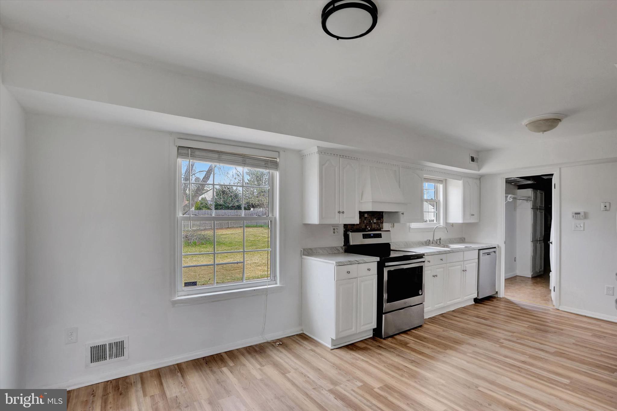 80 Dover Road Westampton, NJ 08060 - Photo 11 of 36 a kitchen with stainless steel appliances granite countertop a stove and a refrigerator