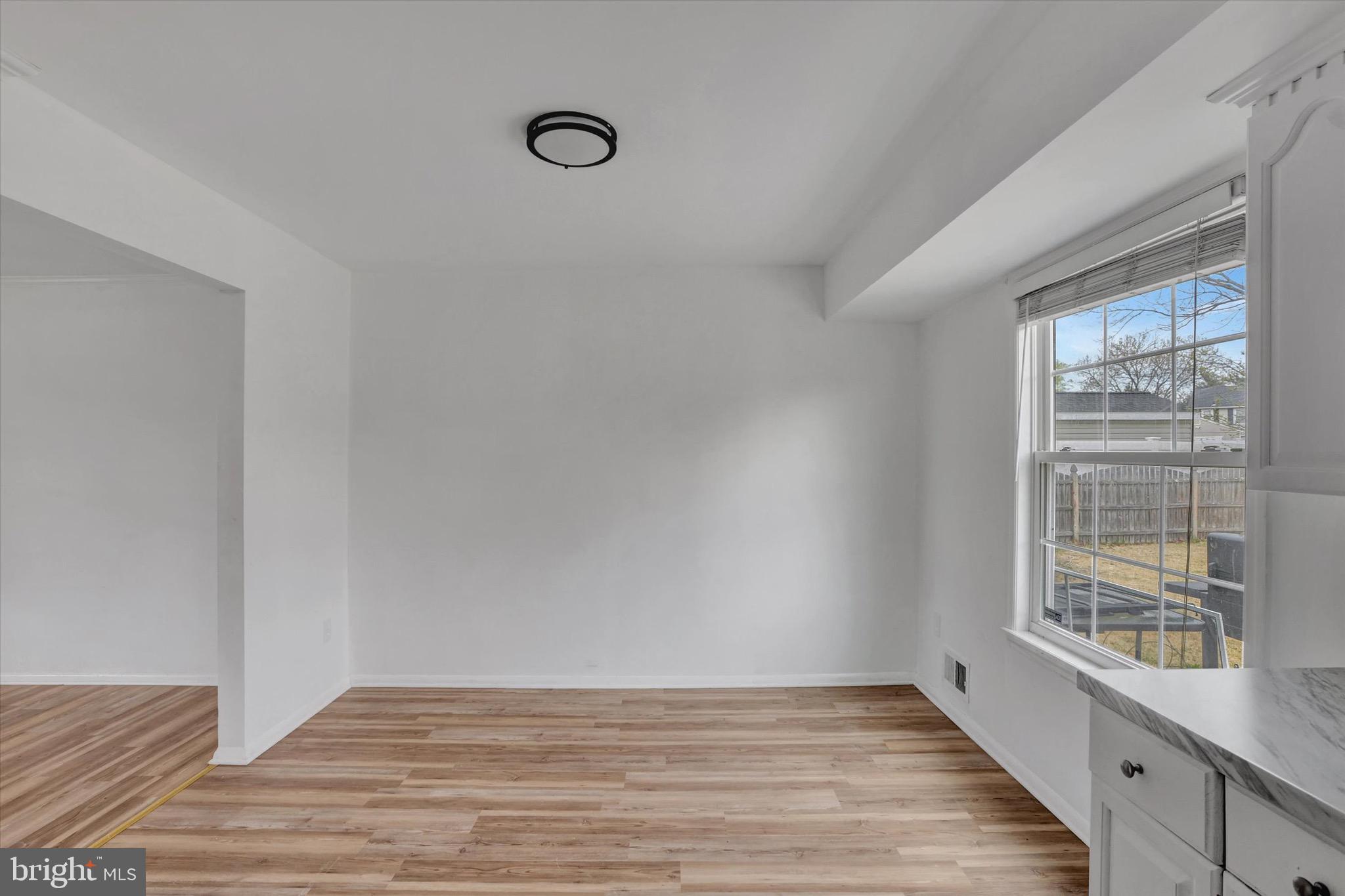 80 Dover Road Westampton, NJ 08060 - Photo 14 of 36 an empty room with wooden floor and windows