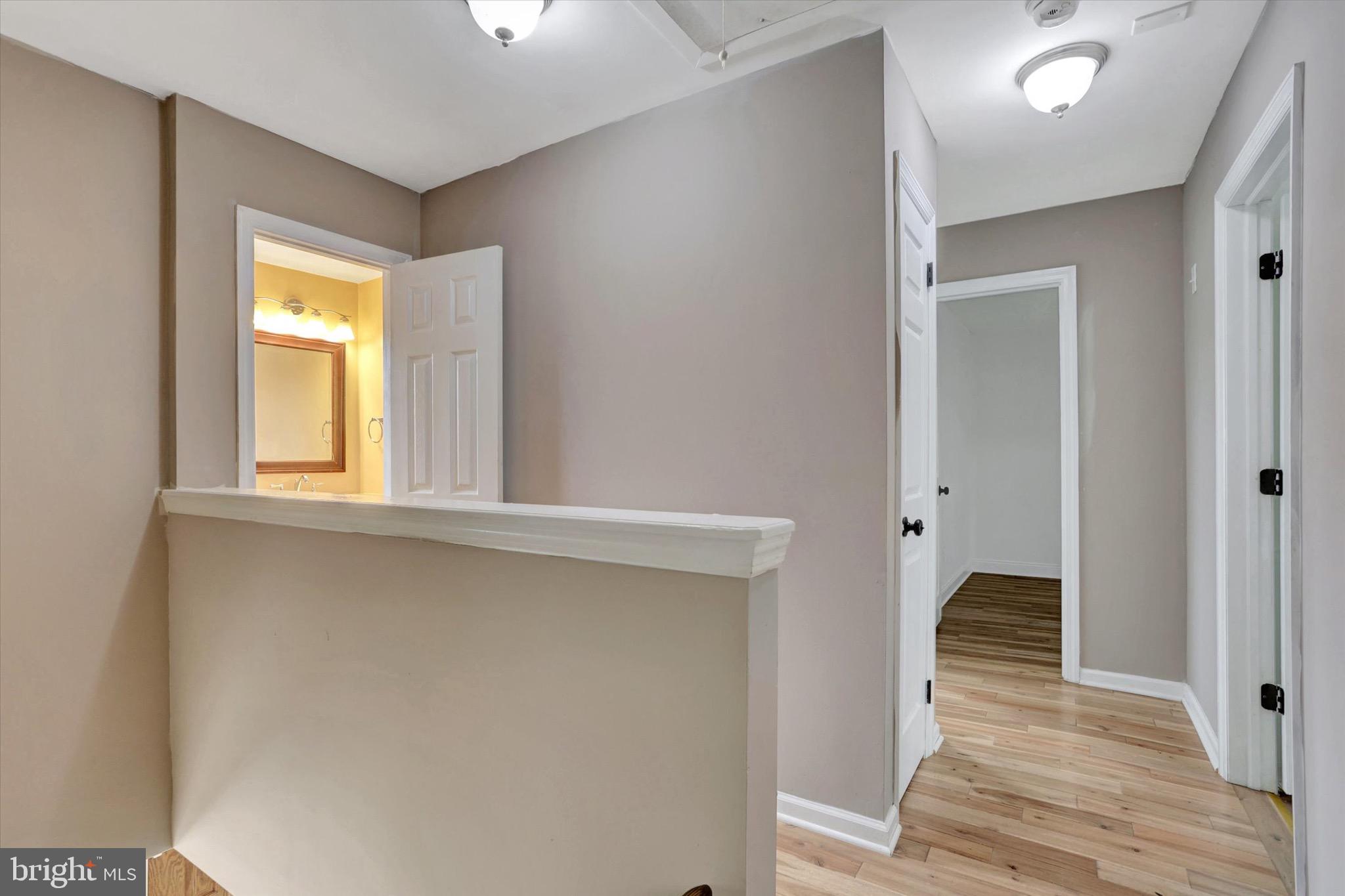 80 Dover Road Westampton, NJ 08060 - Photo 22 of 36 a view of a hallway with wooden floor and closet