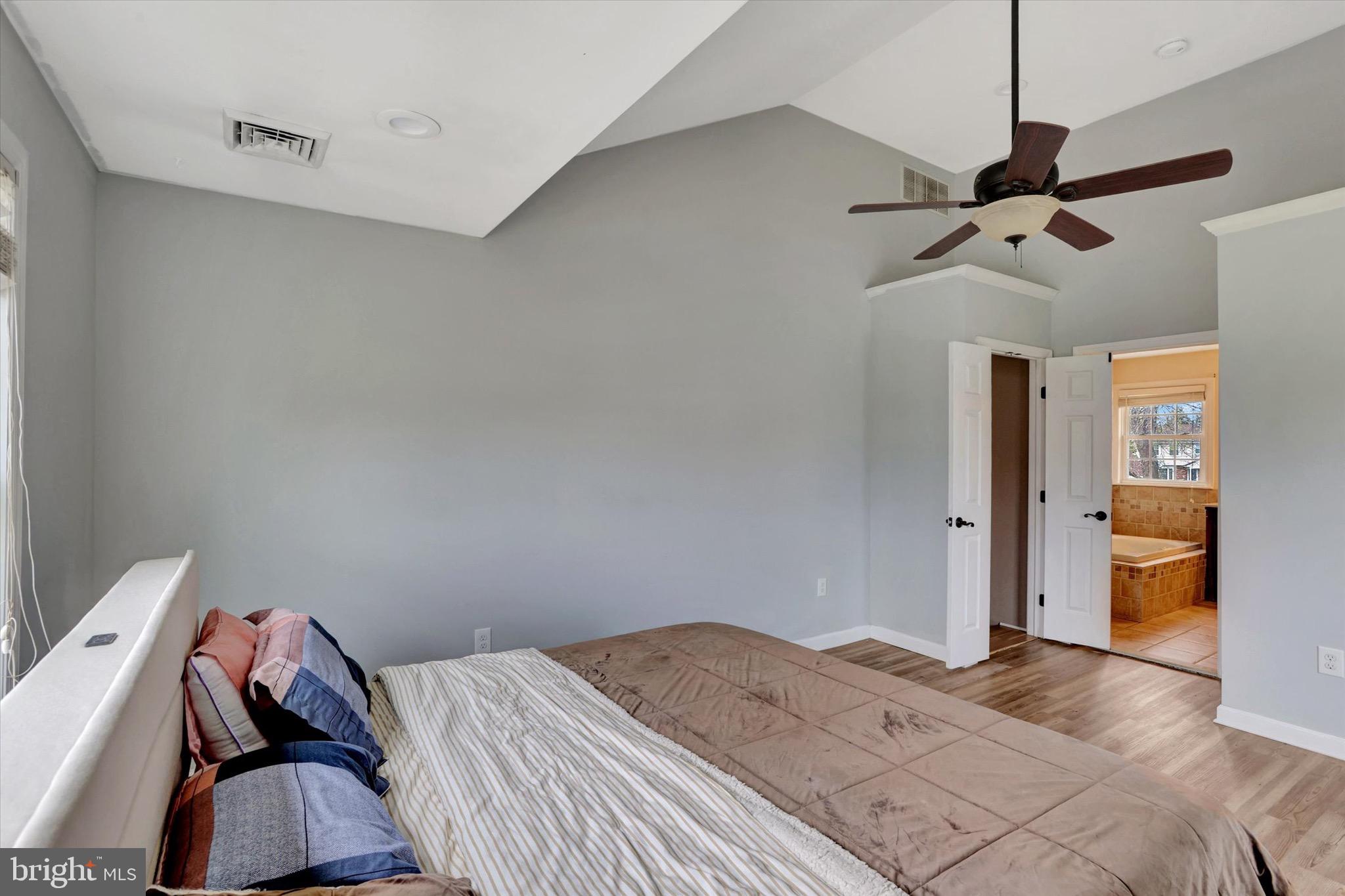 80 Dover Road Westampton, NJ 08060 - Photo 25 of 36 a bedroom with a bed and a chandelier