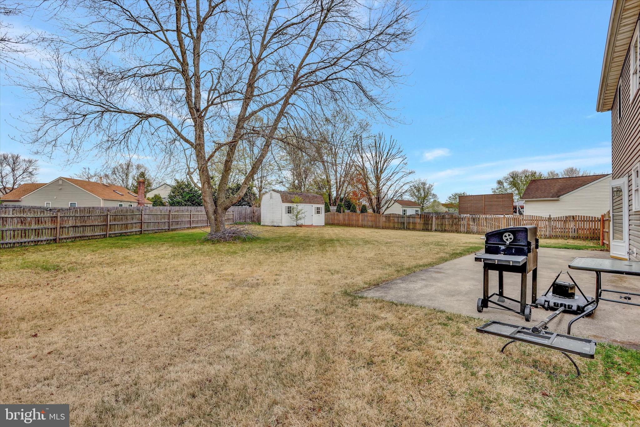 80 Dover Road Westampton, NJ 08060 - Photo 34 of 36 a view of a backyard with table and chairs under an umbrella