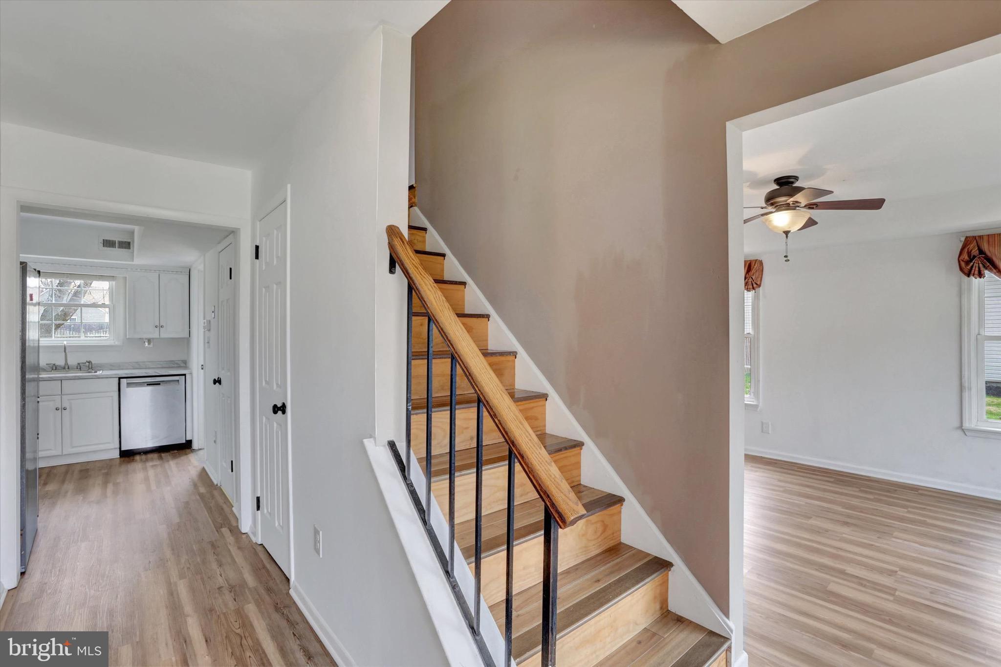 80 Dover Road Westampton, NJ 08060 - Photo 5 of 36 a view of a hallway with wooden floor and staircase
