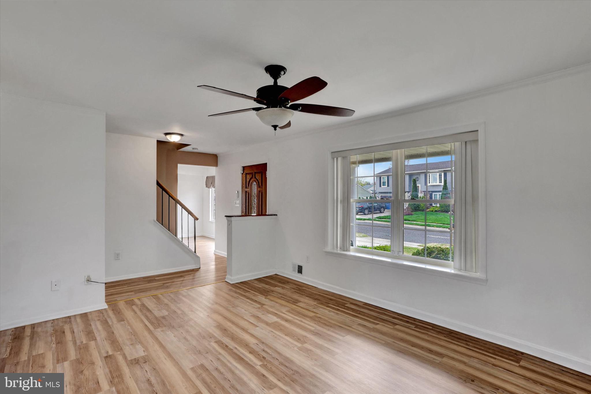 80 Dover Road Westampton, NJ 08060 - Photo 6 of 36 a view of an empty room with wooden floor and a window