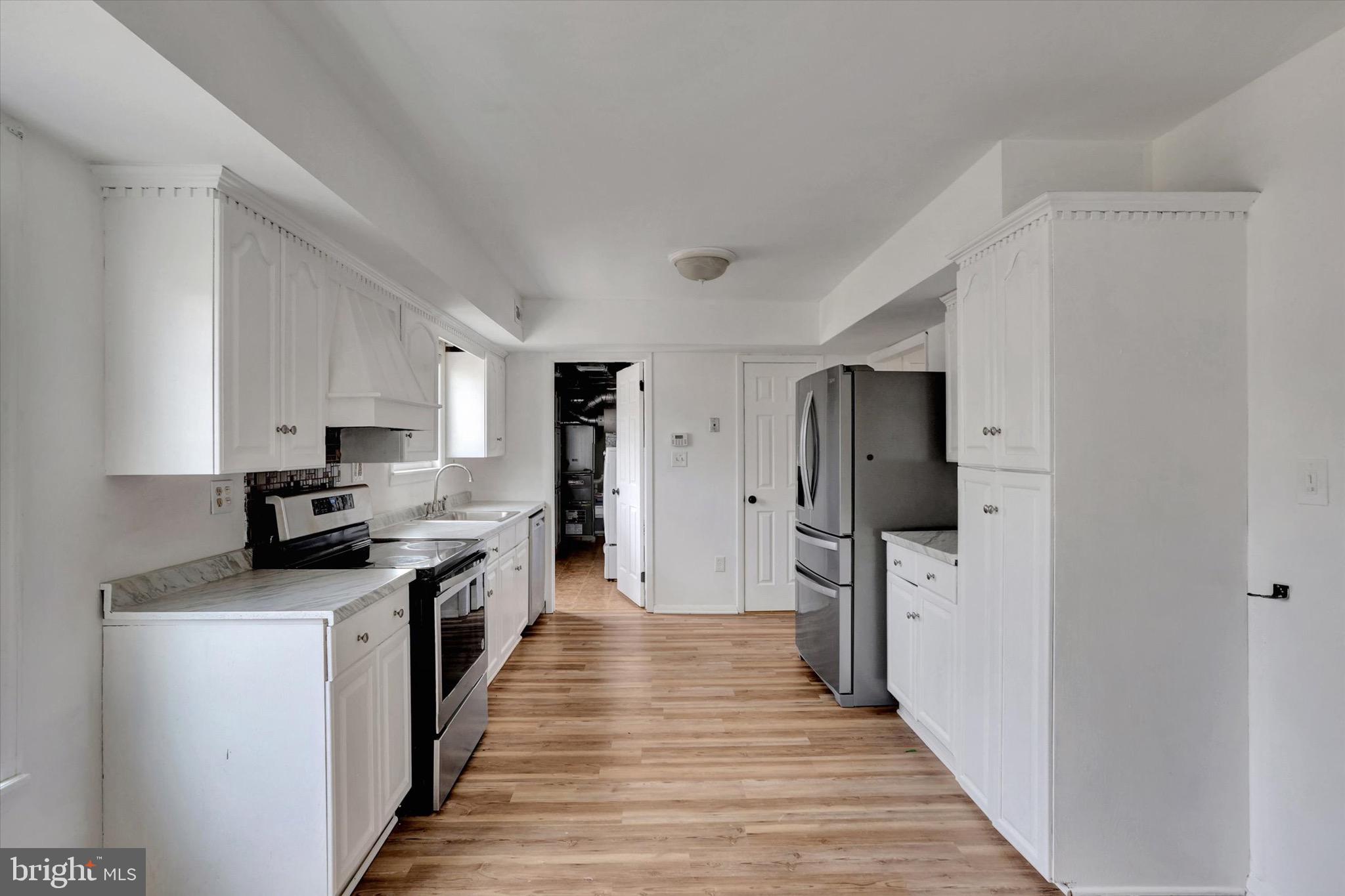 80 Dover Road Westampton, NJ 08060 - Photo 9 of 36 a kitchen with stainless steel appliances a refrigerator stove and sink