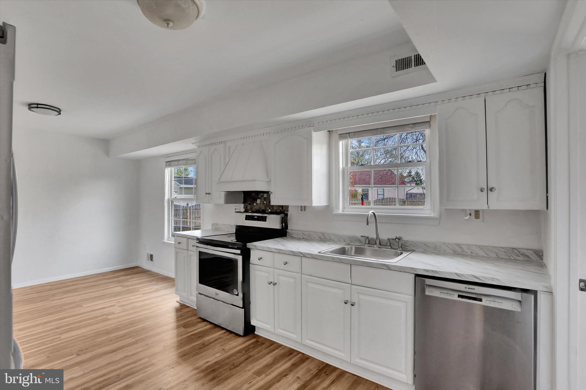 80 Dover Road Westampton, NJ 08060 - Photo 10 of 36 a kitchen with a sink white cabinets and white appliances