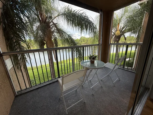 a view of balcony with wooden floor