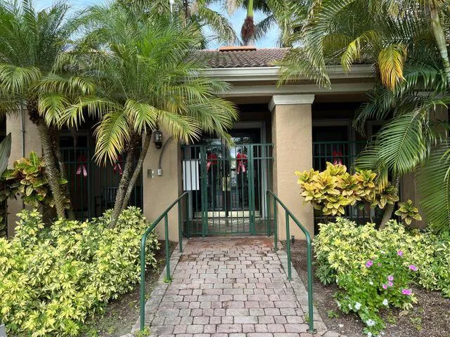 a view of path along with house and trees