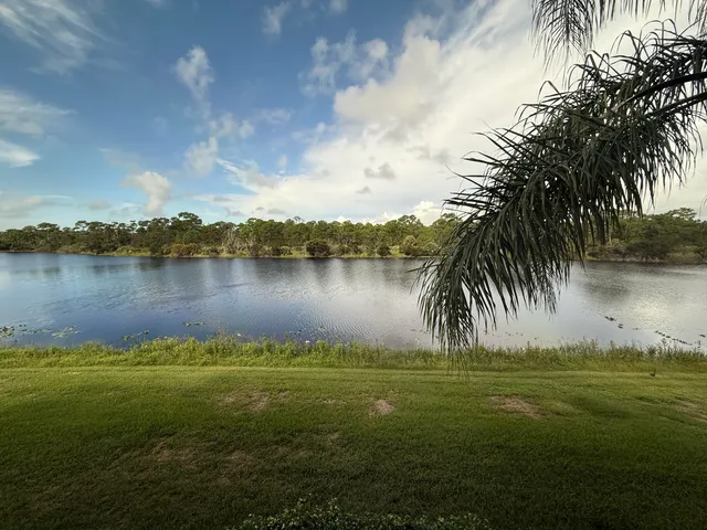 a view of a lake with a big yard