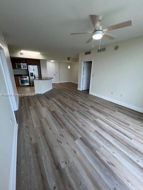 510 Northwest 84th Avenue, Unit 507 Plantation, FL 33324 - Photo 17 of 33 wooden floor in an empty room with a window