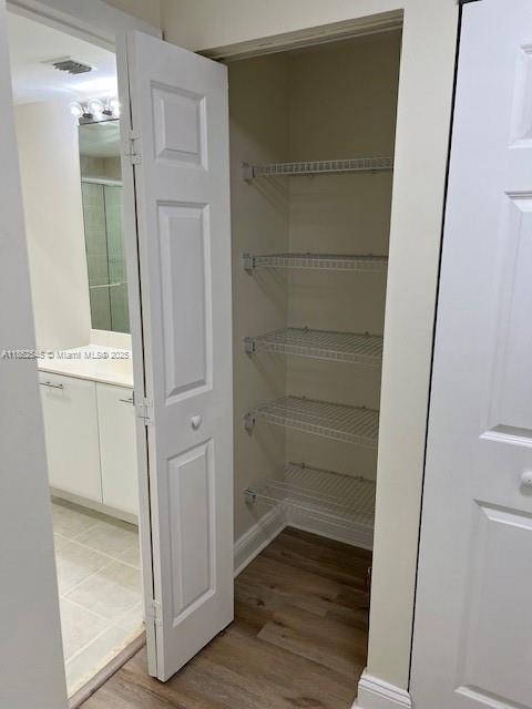 510 Northwest 84th Avenue, Unit 507 Plantation, FL 33324 - Photo 29 of 33 a view of walk in closet with empty racks