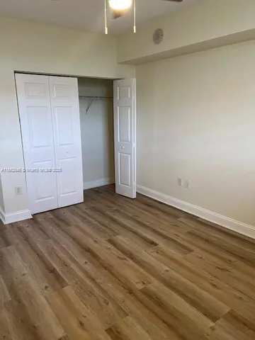 an empty room with wooden floor