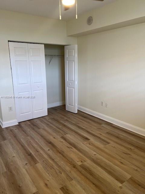 510 Northwest 84th Avenue, Unit 507 Plantation, FL 33324 - Photo 31 of 33 an empty room with wooden floor