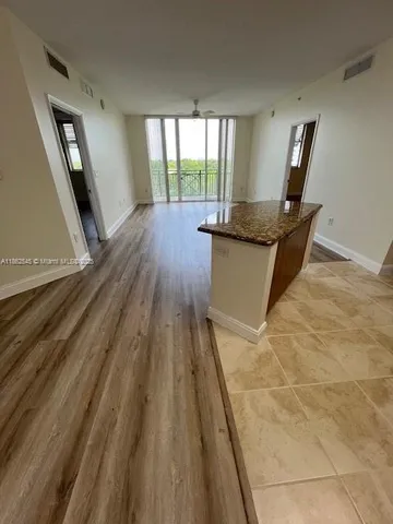 a living room with a rug floor and a rug