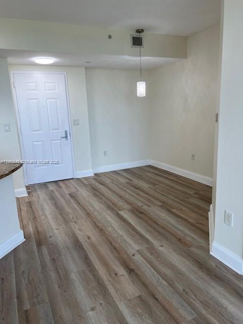 510 Northwest 84th Avenue, Unit 507 Plantation, FL 33324 - Photo 10 of 33 a view of an empty room with wooden floor