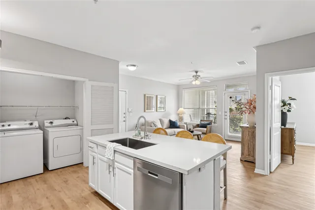 a view of a kitchen counter space and wooden floor