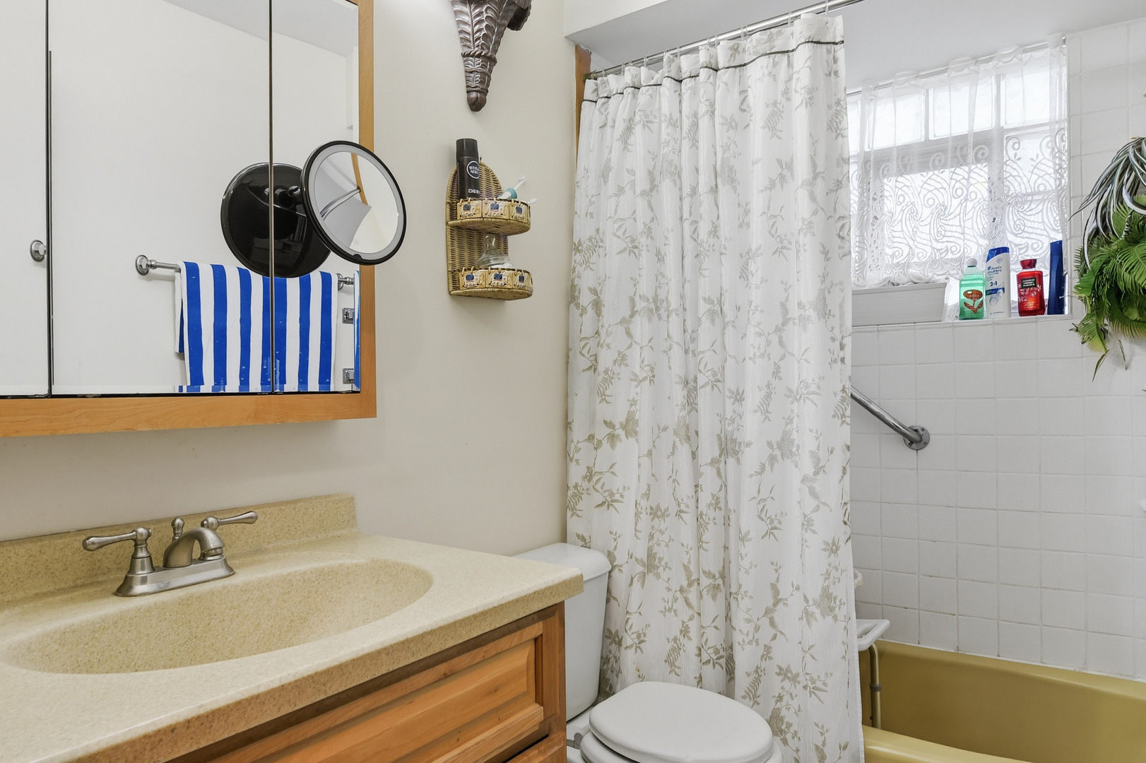 7329 West 85th Place, Unit 2A Bridgeview, IL 60455 - Photo 13 of 15 a bathroom with a sink a toilet and shower