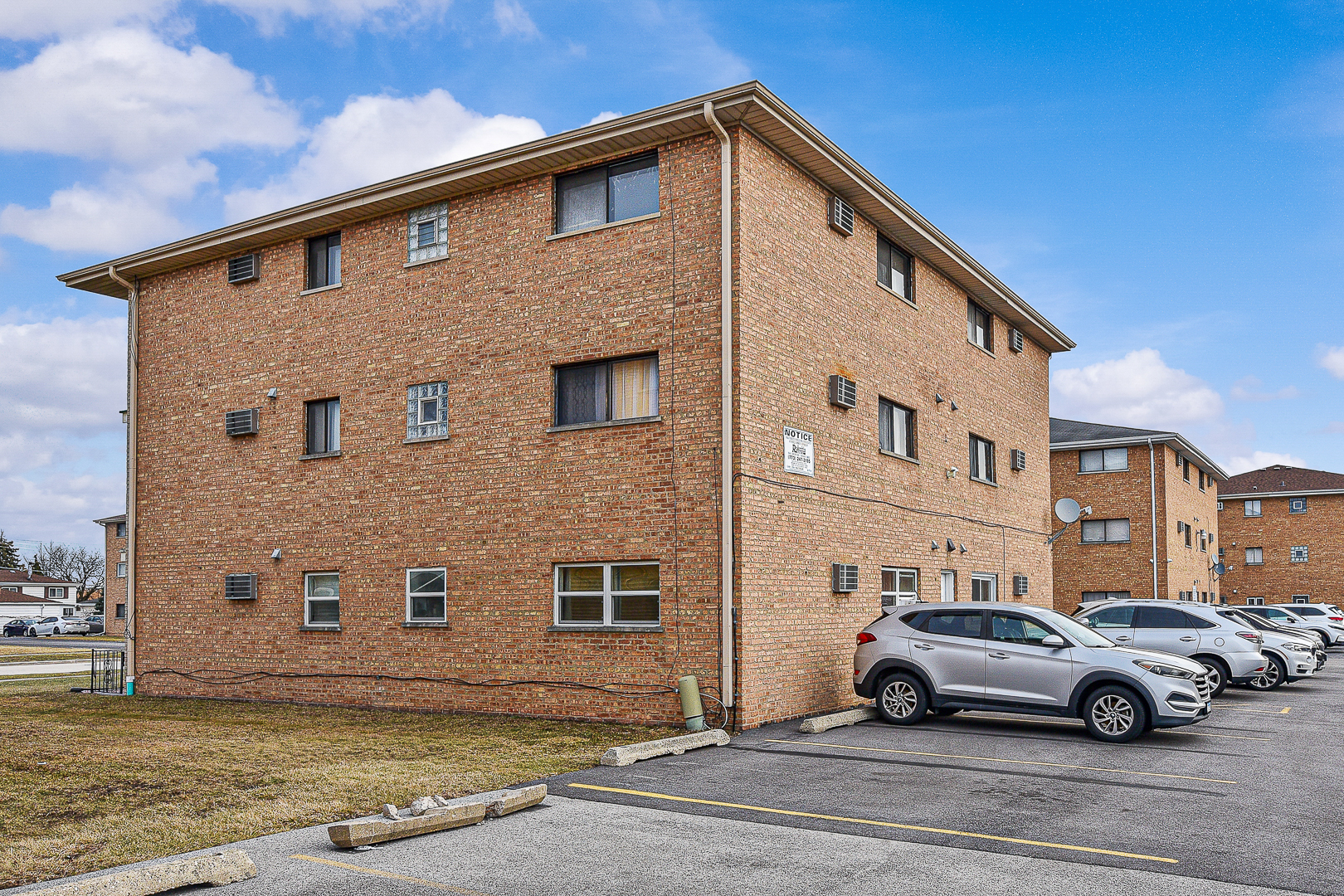 7329 West 85th Place, Unit 2A Bridgeview, IL 60455 - Photo 15 of 15 a front view of a house with parking space