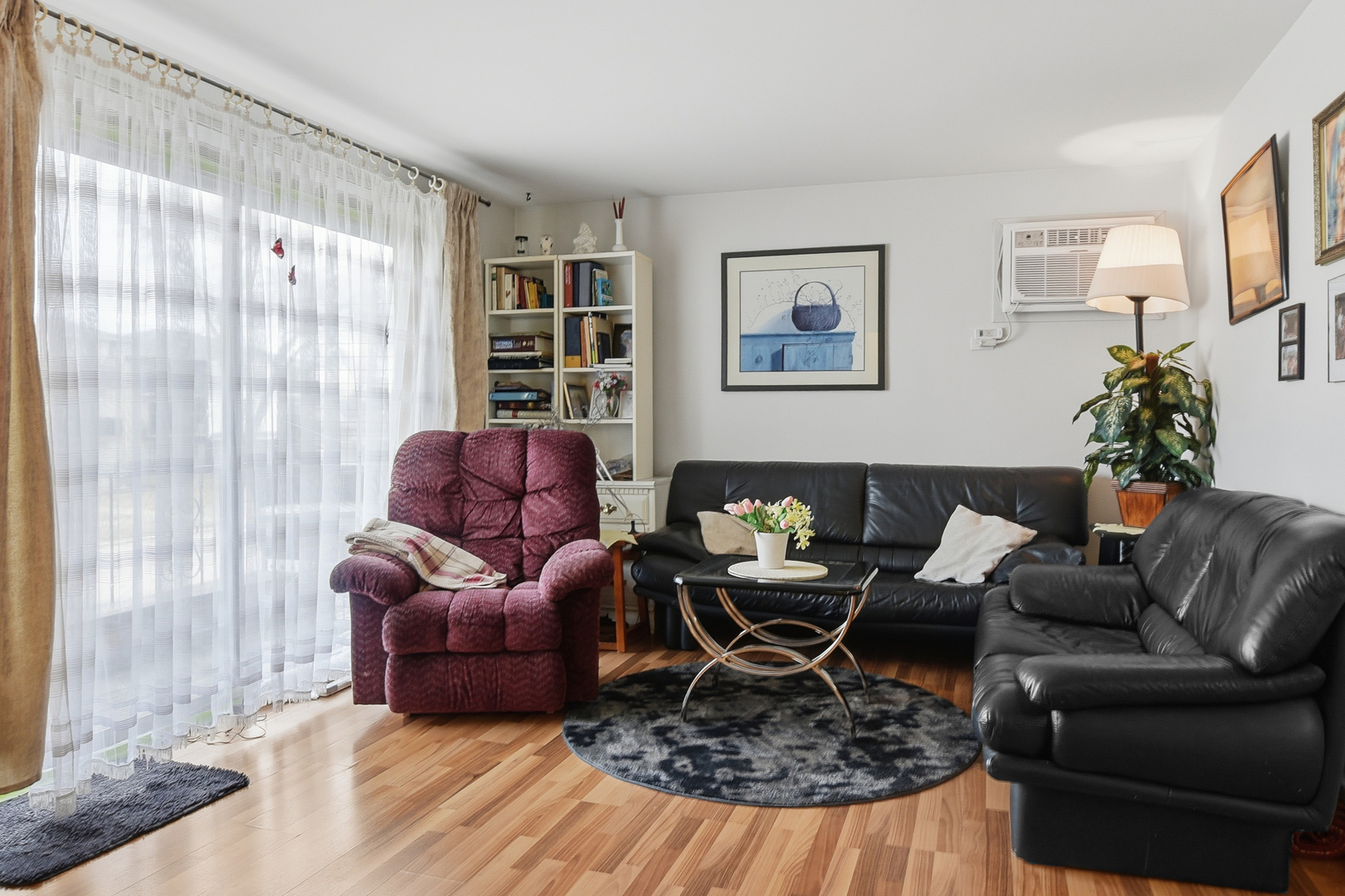 7329 West 85th Place, Unit 2A Bridgeview, IL 60455 - Photo 4 of 15 a living room with furniture rug and lamp