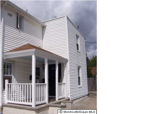 312 Morris Avenue, Unit UPPR Spring Lake, NJ 07762 - Photo 1 of 3 a view of a house with a porch