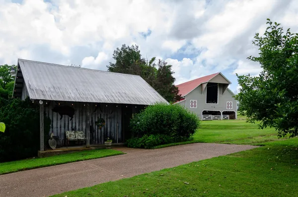 a outdoor space with patio lots of furniture and white umbrellas