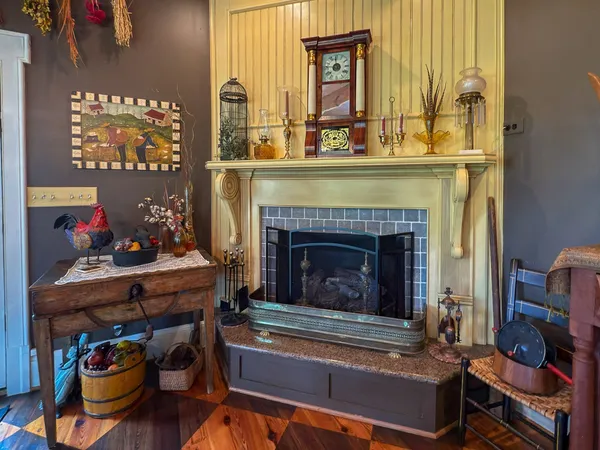 a living room with lots of furniture chandelier and a rug