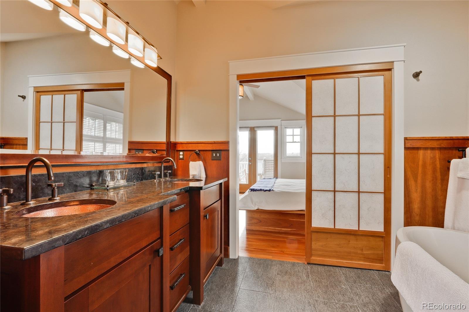 2220 Mesa Drive Boulder, CO 80304 - Photo 17 of 40 a bathroom with a tub a sink and a large window