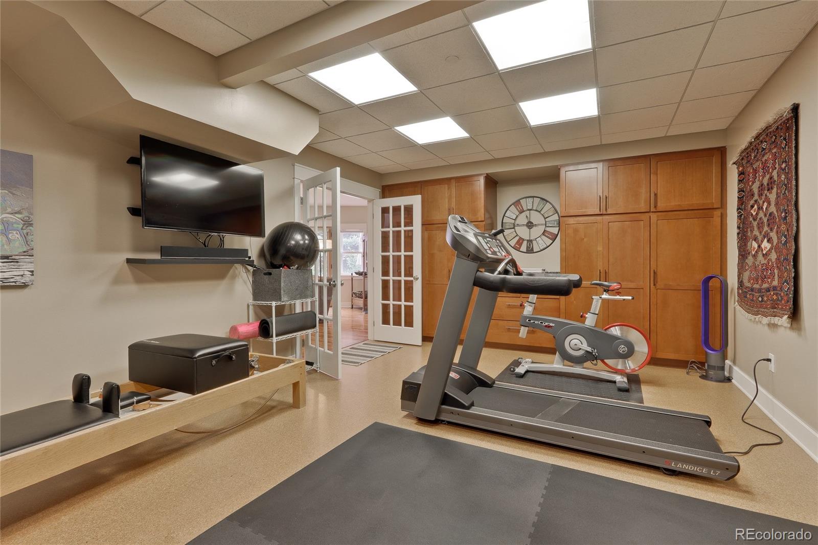 2220 Mesa Drive Boulder, CO 80304 - Photo 32 of 40 a room with gym equipment and flat screen tv